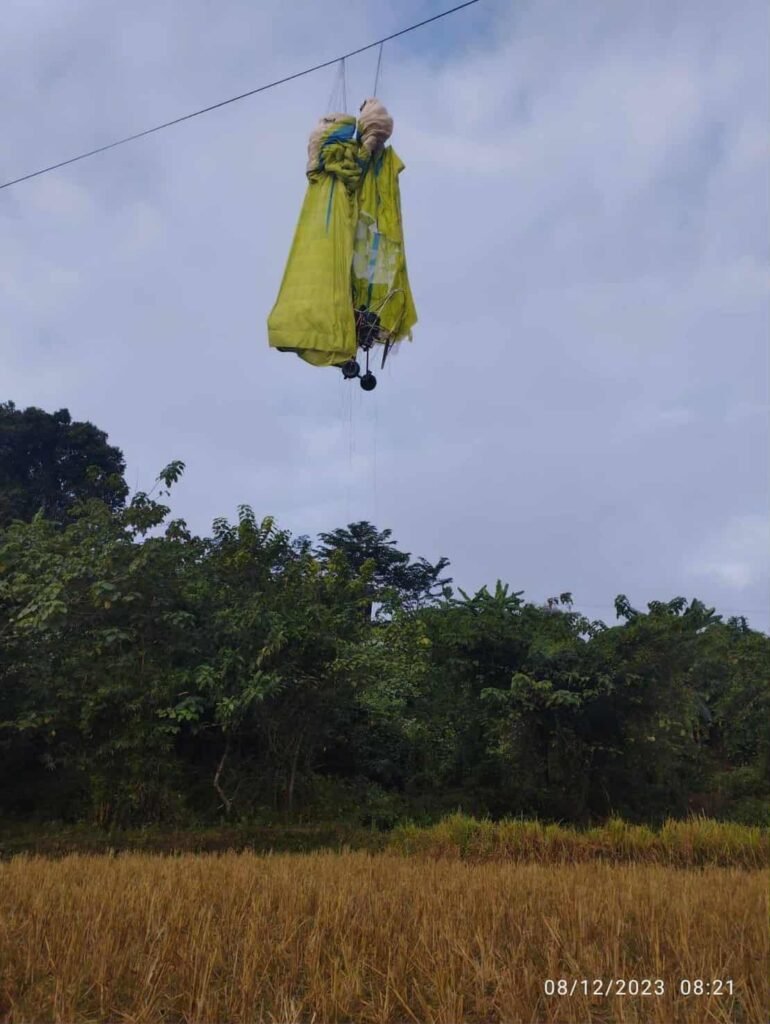 Real-world paramotor accident scene in Laos documented by laoparamotor.com showing equipment entanglement for safety awareness